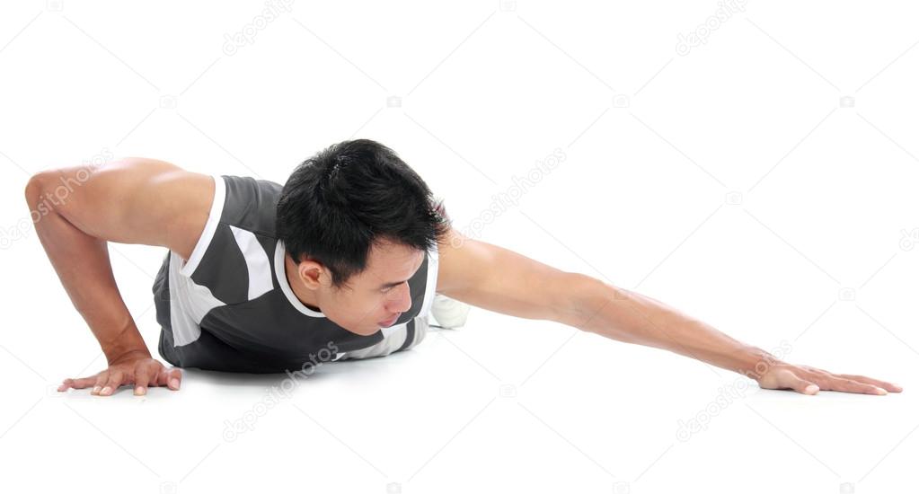 Young man doing push up exercise
