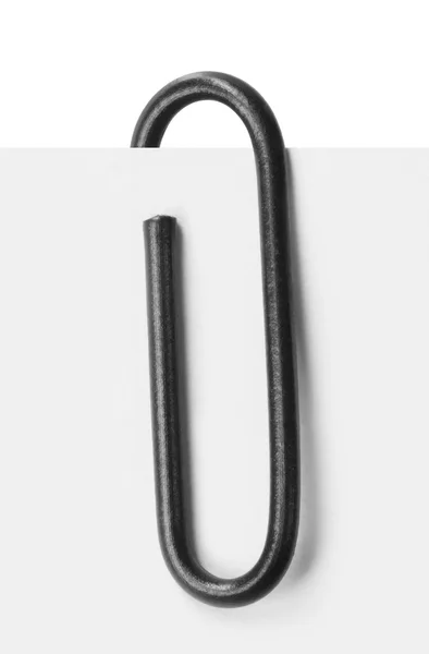 Close up of a black paper clip — Stok fotoğraf