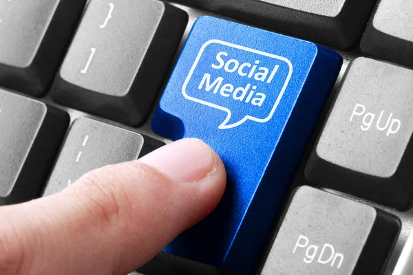 Blue social media button on the keyboard — Stock Photo, Image