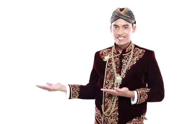 Happy of man wearing traditional of java presenting blank area — Stok Foto