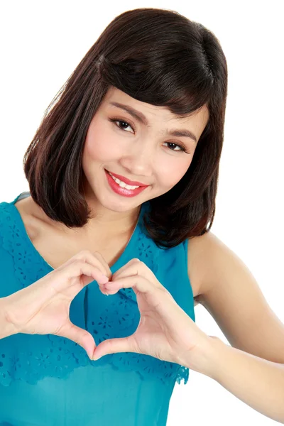 Serce w kształcie przez ręce pięknych młodych kobiet — Zdjęcie stockowe
