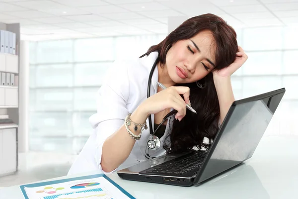 Young doctor having headache — Stock Photo, Image