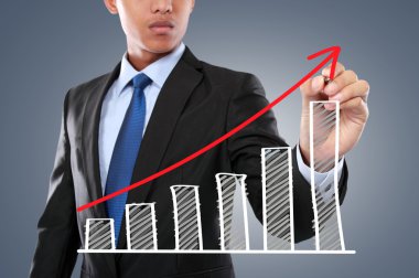 businessman hand drawing virtual chart