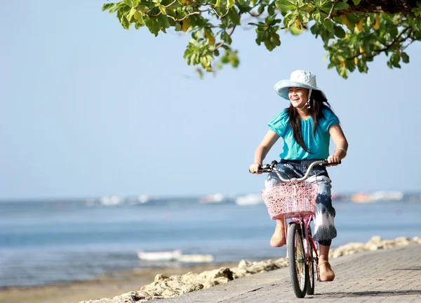 Happy attractive litte girl riding bike outdoor — Stock Photo, Image