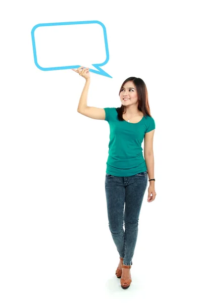 Portrait of full lenght young girl holding blank text bubble in — Stock Photo, Image