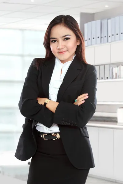 Beautiful business woman with arm crossed — Stock Photo, Image