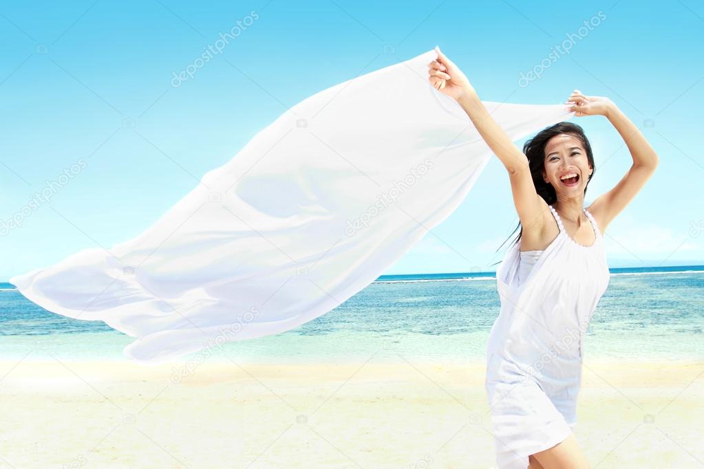 Beautiful Girl With White Scarf on The Beach