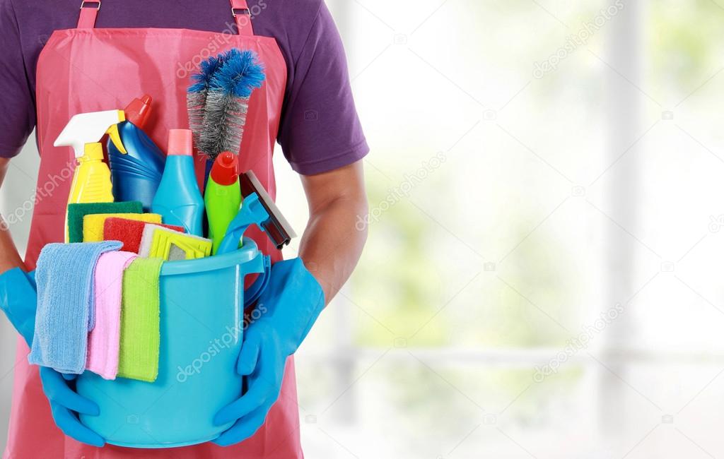 Portrait of man with cleaning equipment