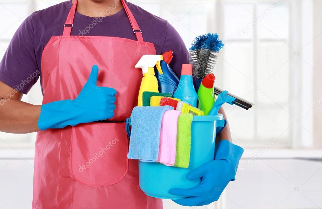 Portrait of man with cleaning equipment thumbs up