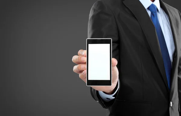 Businessman holding mobile smart phone with blank screen — Stock Photo, Image