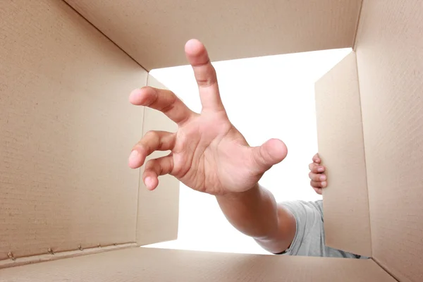 Hand take something inside box — Stock Photo, Image