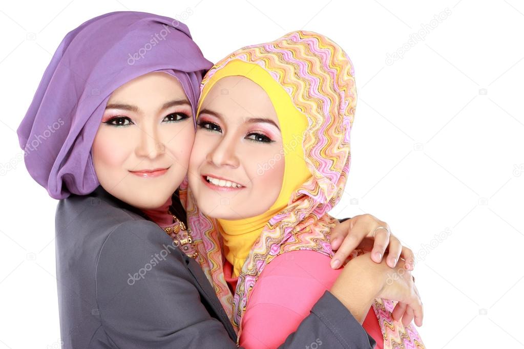 Portrait of two beautiful muslim woman having fun