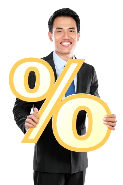 Attractive businessman holding percent sign — Stock Photo, Image