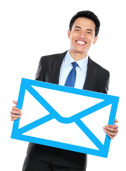 Smiling businessman holding sign of envelope — Stock Photo, Image