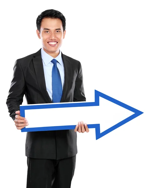 Businessman holding arrow in hand — Stock Photo, Image