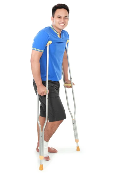 Male with broken foot using crutch — Stock Fotó