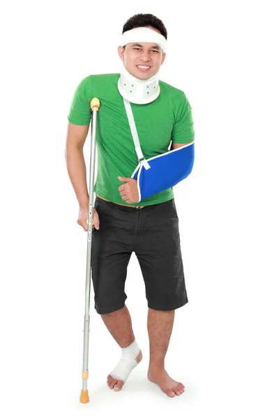 Male with broken arm and crutch — Stock Photo, Image