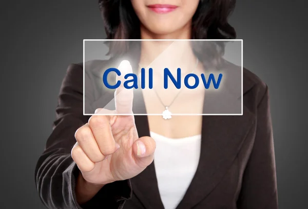 Business woman push to call now button on virtual screen — Stok Foto
