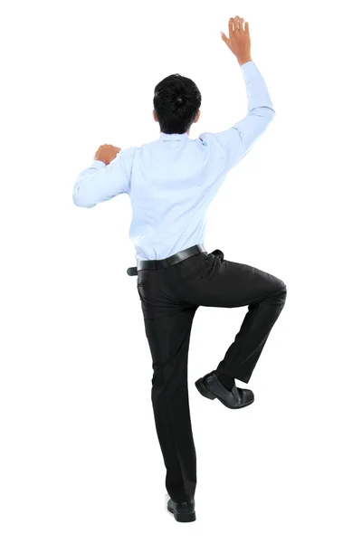 Retrato de hombre de negocios trepar la pared — Foto de Stock