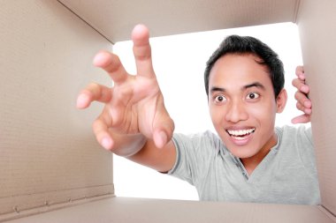 man trying to take something inside box clipart