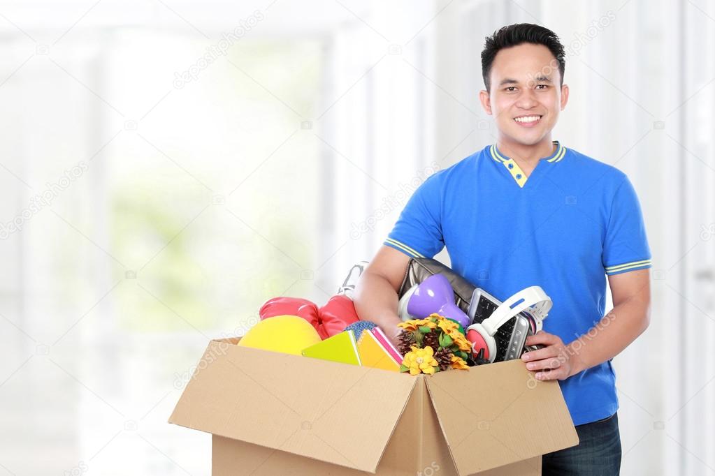 moving day. man with cardboard box