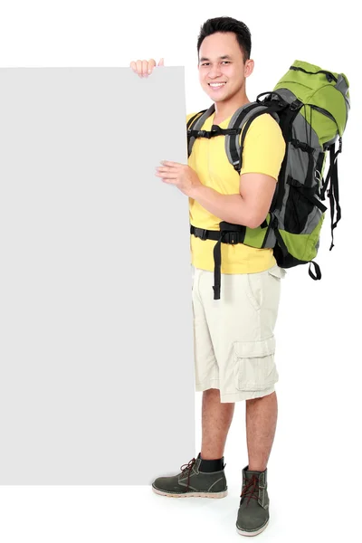 Hiker man tourist  with blank board — Stock Photo, Image