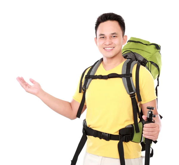 Male hiker with backpack presenting — Stock Photo, Image