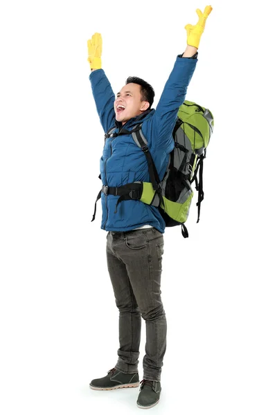 Male hiker with backpack raised his arm — Stock Photo, Image