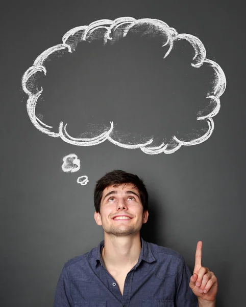 Man looking and pointing up to blank bubble speech — Stock Photo, Image