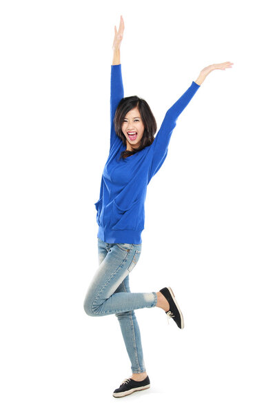 Attractive young happy woman raised her arm