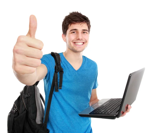 Ung manlig student med laptop visar tummen — Stockfoto