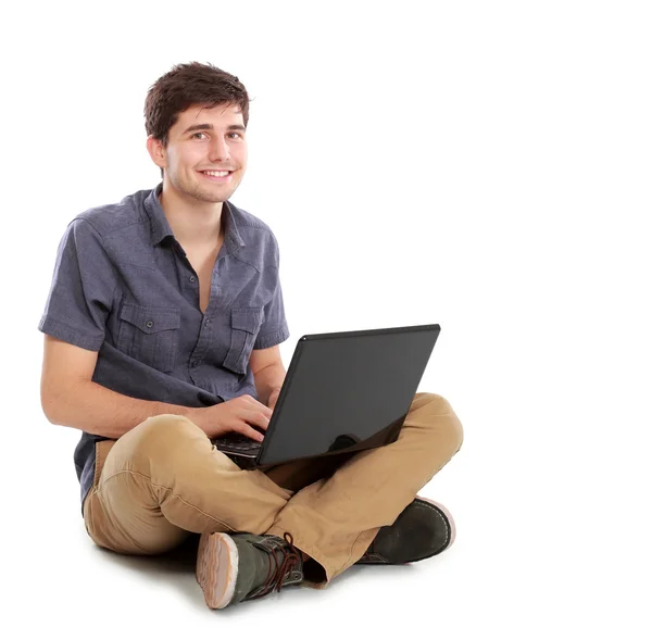 Jongeman met laptop computer — Stockfoto