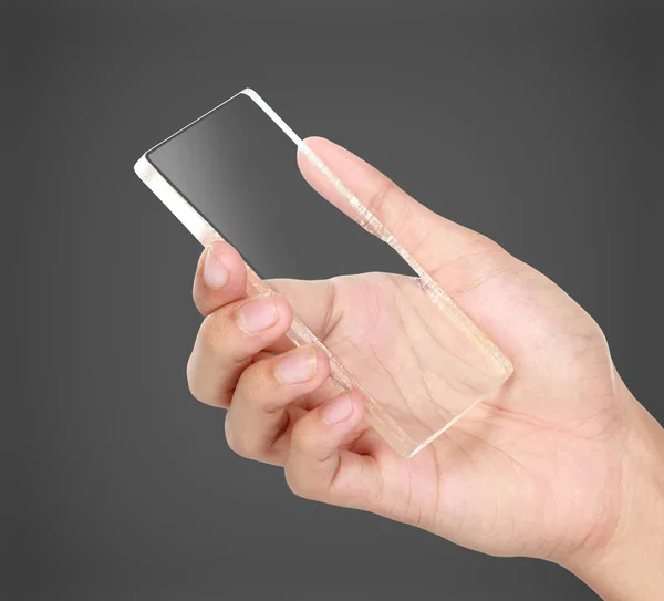 Hands holding futuristic transparent mobile phone — Stock Photo, Image