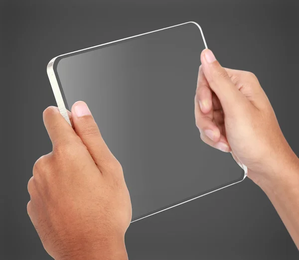Ruce držící futuristické průhledné počítače tablet pc — Stock fotografie