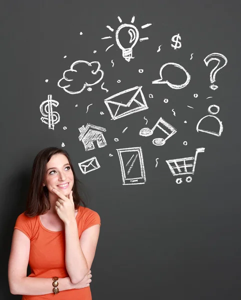 Woman looking up to multimedia icon — Stock Photo, Image