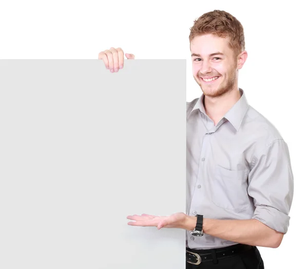 Young man holding blank billboard — Stock Photo, Image