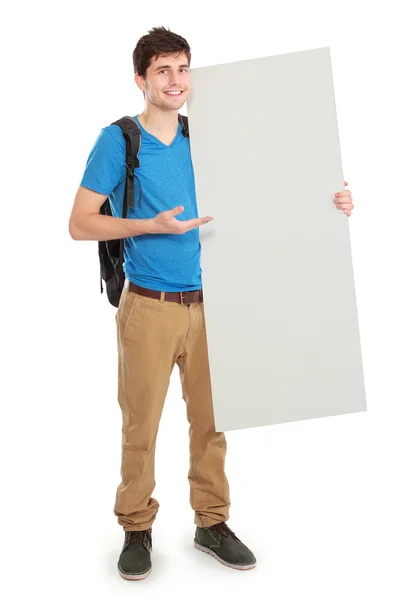 Jonge mannelijke student houden wit leeg bord — Stockfoto
