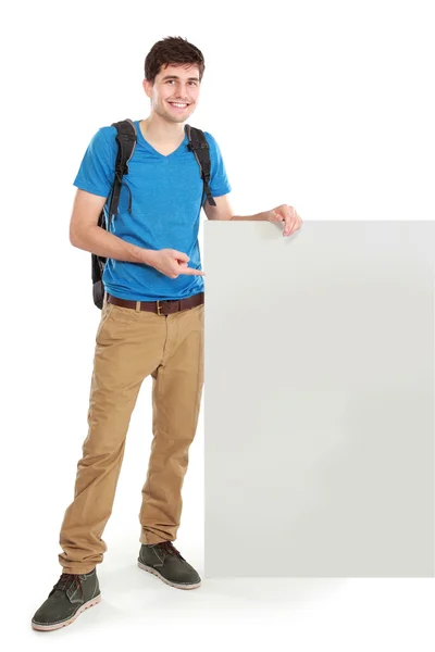 Jovem estudante masculino segurando placa branca em branco — Fotografia de Stock