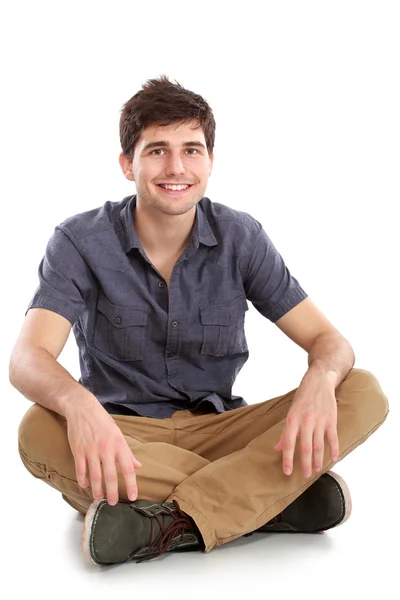 Mann sitzt auf weißem Hintergrund — Stockfoto