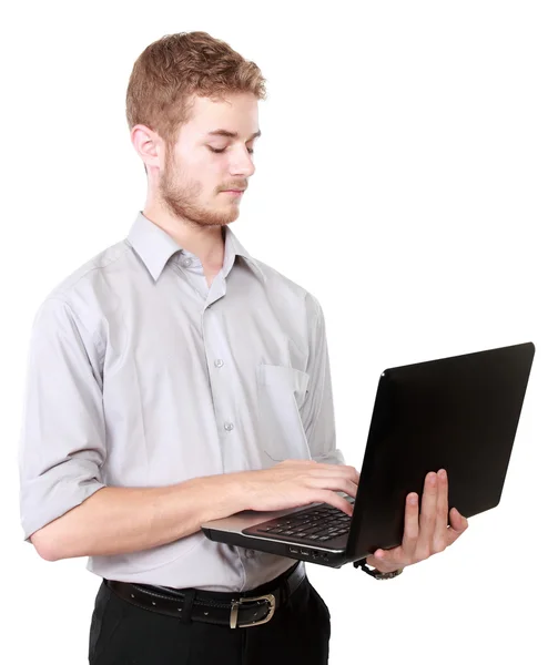 Ung affärsman med laptop pc på vit — Stockfoto