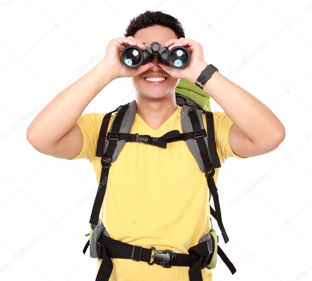 hiking man tourist looking with binoculars