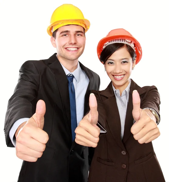 Two standing workers showing thumbs up — Stock Photo, Image