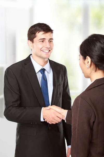 Interviewer shaking hand to future employee Stock Photo