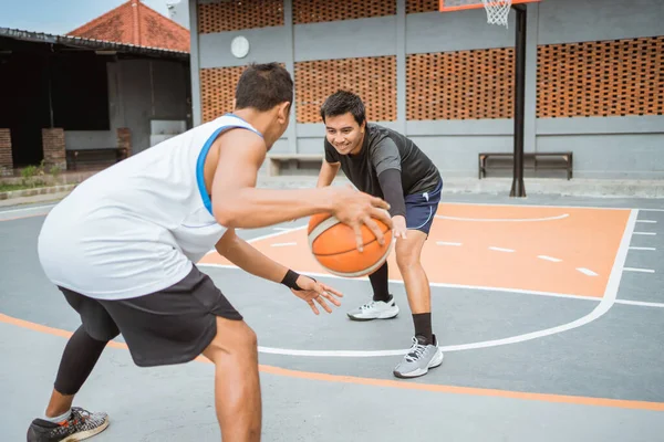 a defender prevents an opposing player from dribbling the ball while playing