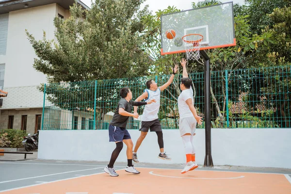 Basketball player jumping with rebound position while playing — Stock Photo, Image