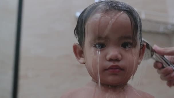 Asian toddler taking shower in bathroom — Stock Video © odua #515861078
