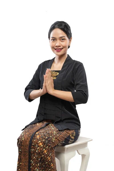 Woman wear kebaya her palms together in front of her chest greeting — Stock Photo, Image