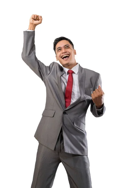 Excited young businessman raise his hand isolated over white — Stock Photo, Image