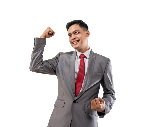 Excited young businessman raise his hand isolated over white — Stock Photo, Image