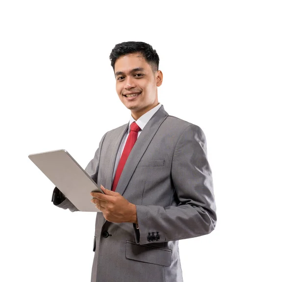 Zakenman holding tablet pc geïsoleerd over witte achtergrond — Stockfoto